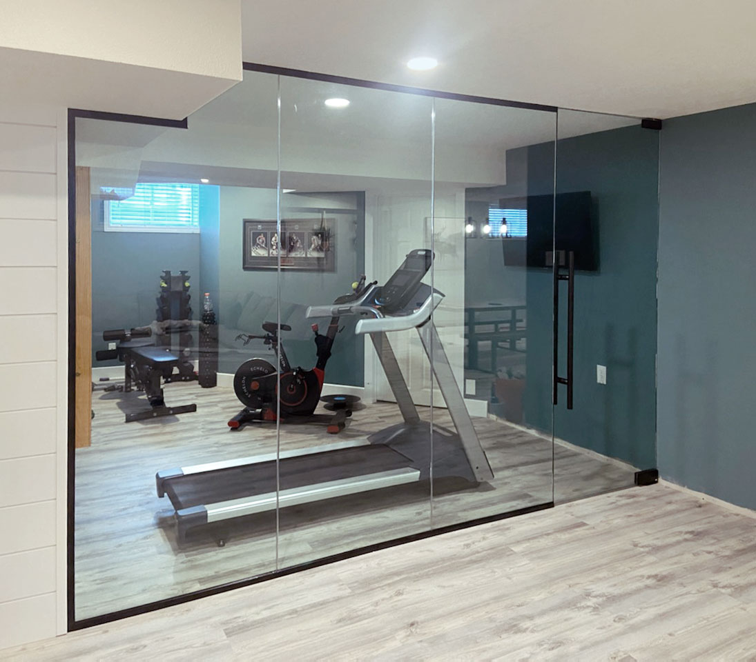 Glass wall and partitions with sliding door for home gym