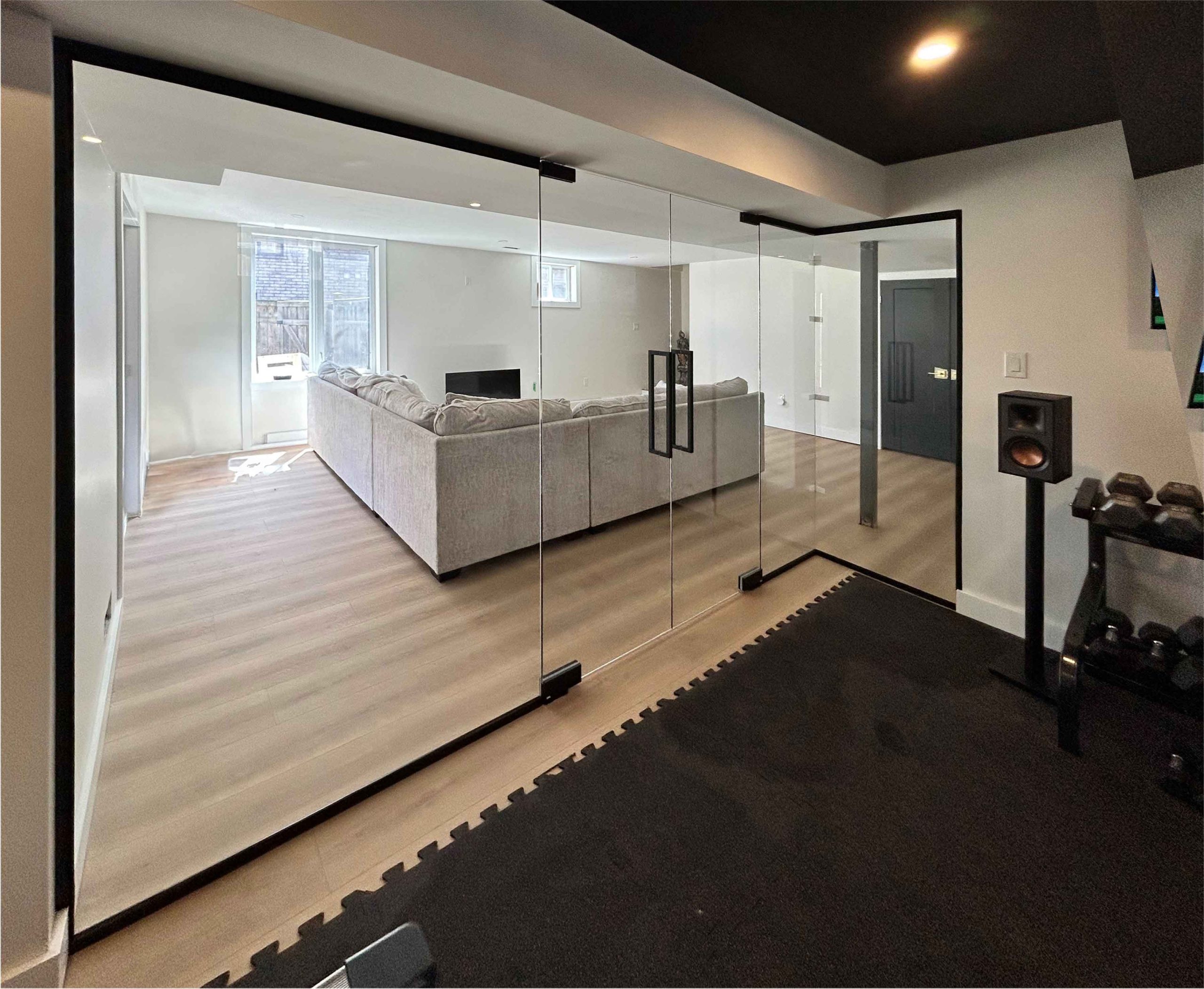 Glass wall and partitions with sliding door for home gym